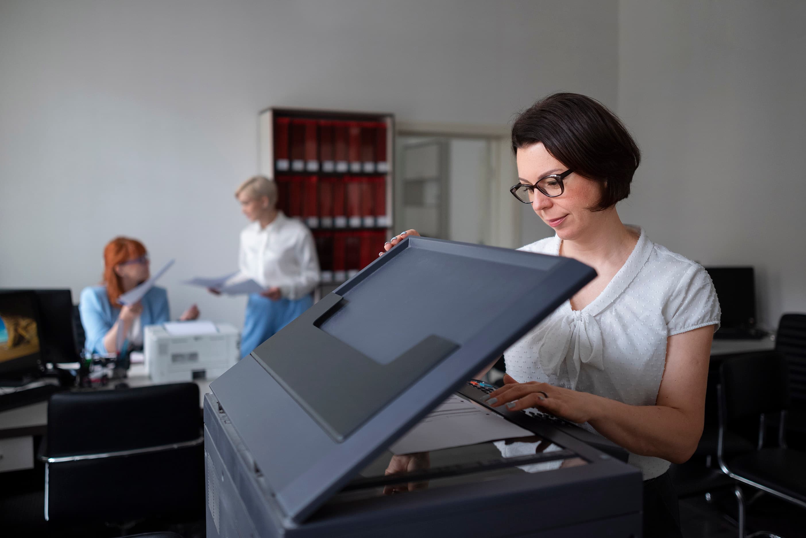 Office worker using a multifunction copier